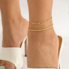 Chevillière double dorée - Bijoux de chevilles pour travestis Chevillière double dorée - Bijoux de chevilles pour travestis